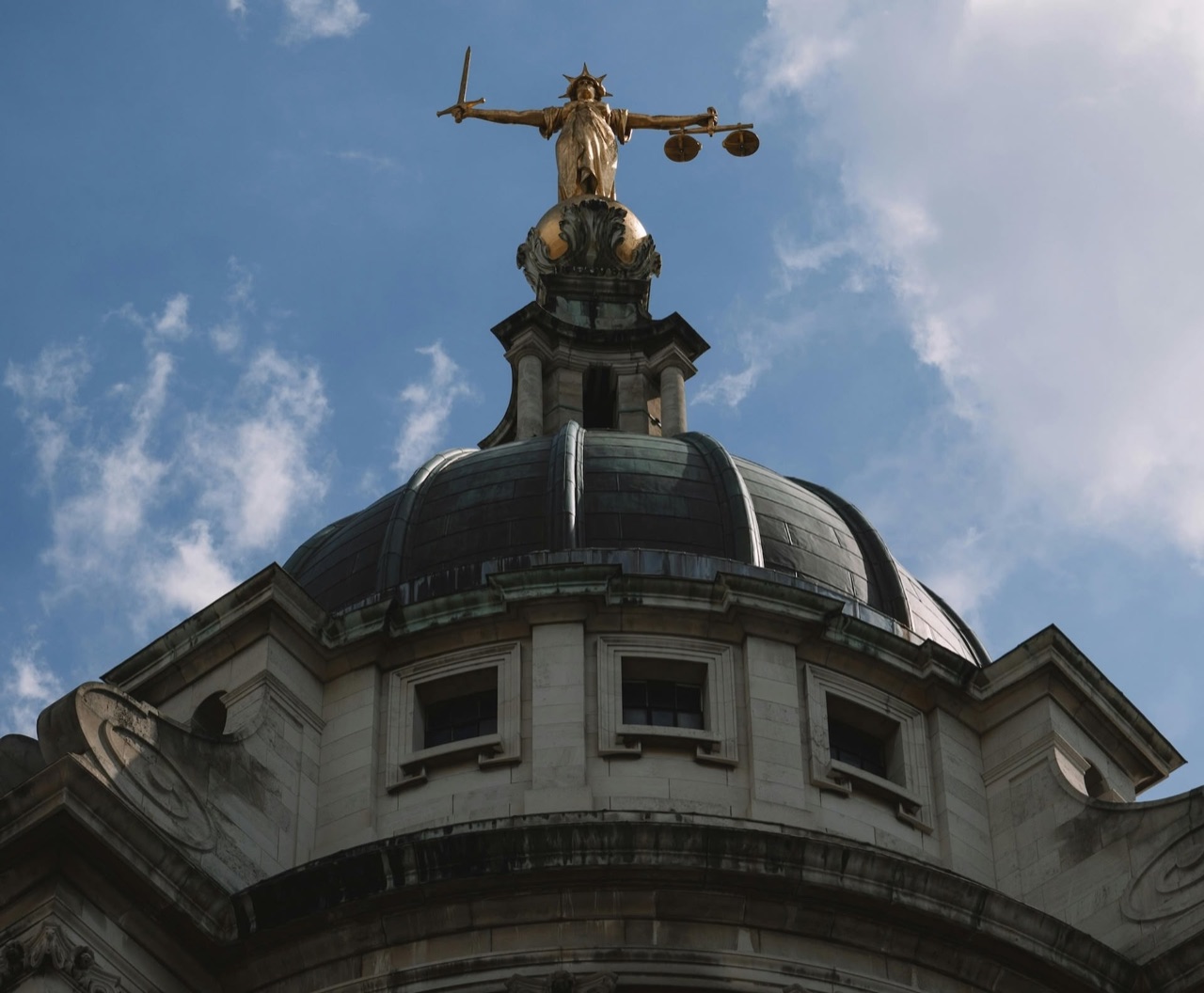 Lady Justice above the courthouse dome, from our original homepage